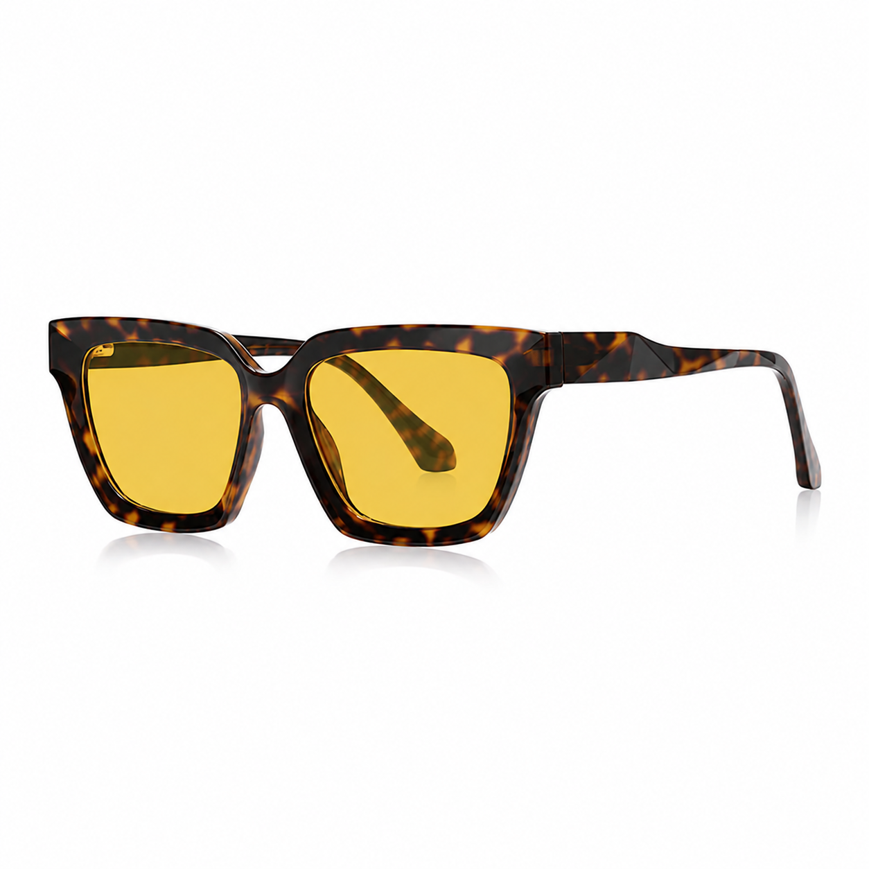 Óculos Vesper Day tartaruga com lentes amarelas de filtro de luz azul, armação angular e design marcante sobre fundo branco.