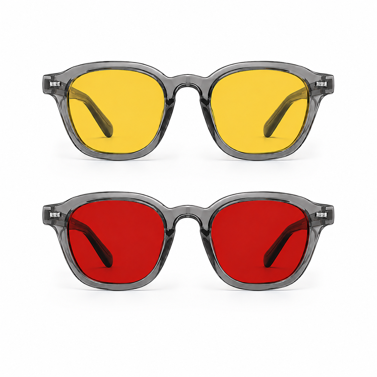 Óculos AURA Kit Day + Night com armação Smoke, apresentados de frente sobre fundo branco, com lentes amarelas na versão Day na parte superior e lentes vermelhas na versão Night na parte inferior.