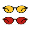 Óculos LUMA Kit apresentados em duas versões sobre fundo branco: armação preta com lentes amarelas na parte superior para o Day e armação Tortoise com lentes vermelhas na parte inferior para o Night, destacando o formato ovalado do modelo.